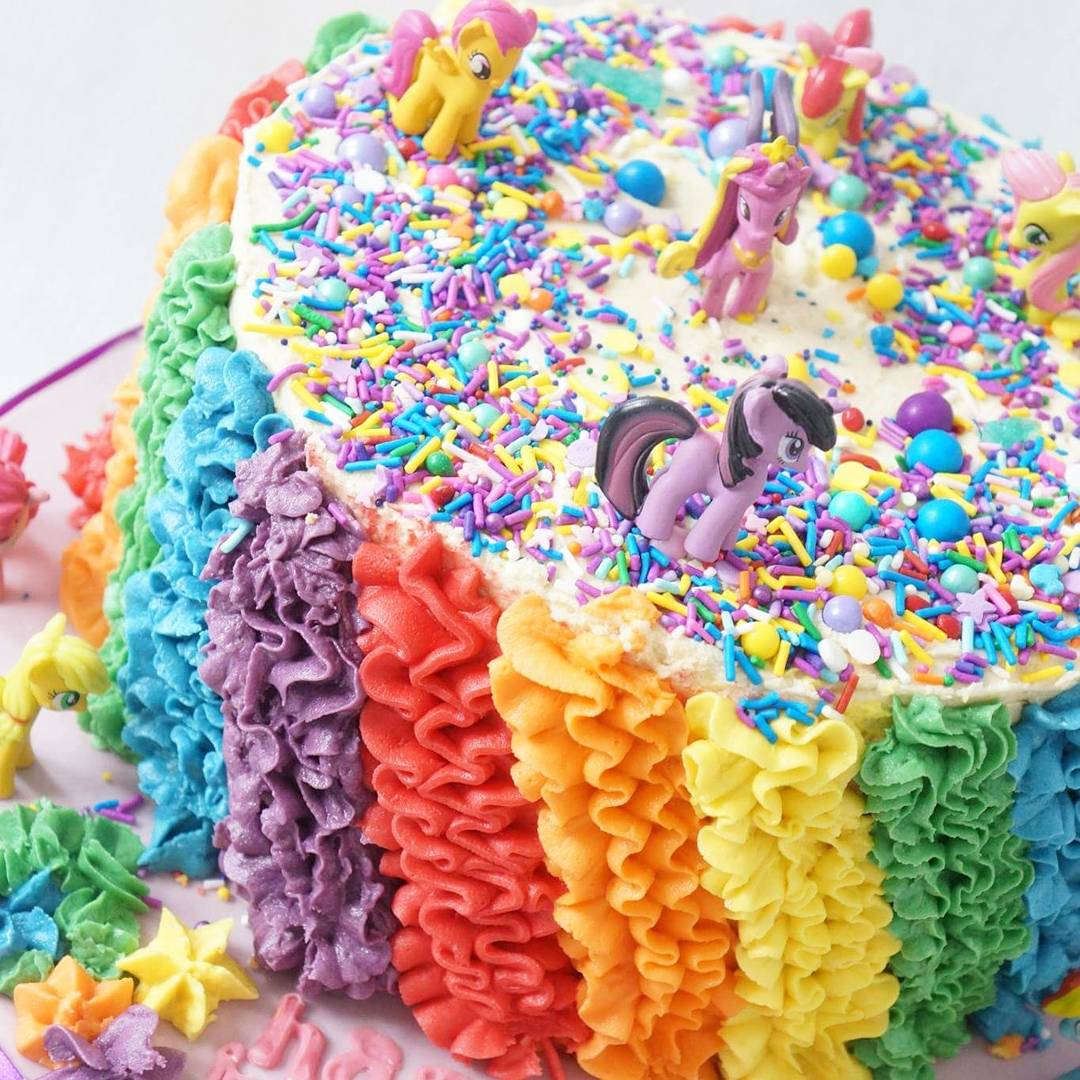 LilyBloomCakes's tweet photo. Super bright and colourful @MyLittlePony cake with @Sweetapolita sprinkles and ruffles with @WiltonCakes 2d tip. #buttercream #mylittlepony https://t.co/LhjmPasGTD