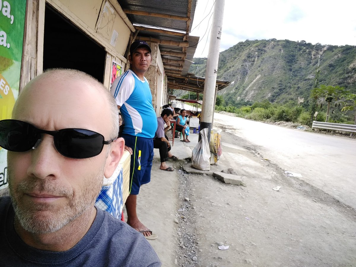 Just sitting on the side of the road waiting for a car to take me to town. Campo time is different...