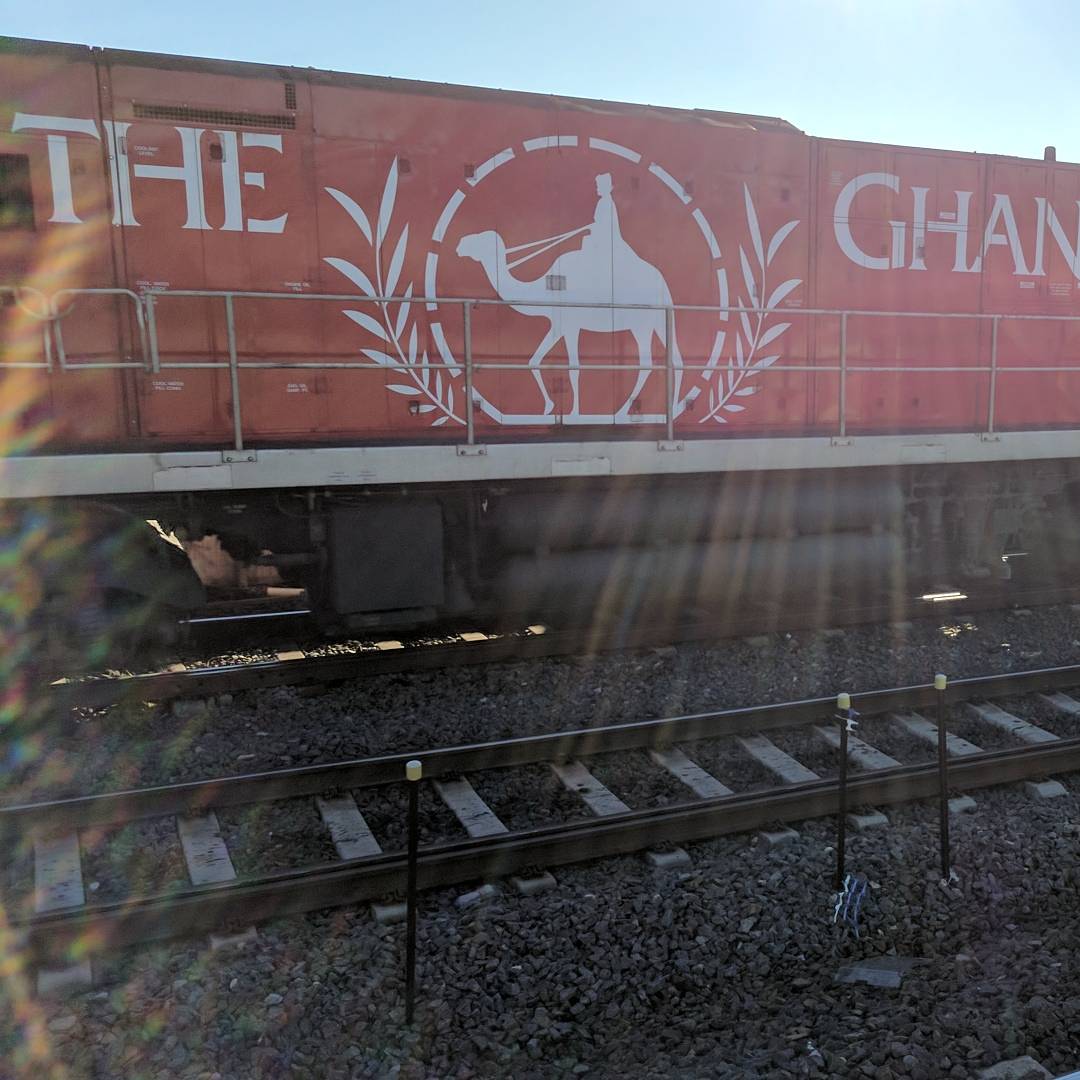ameel's tweet photo. This @PacificNatl #NR75 engine was pulling one of the longest freight trains I've ever seen! #TheGhan #MiddleFootscrayStation https://t.co/9p1dCS2GnE