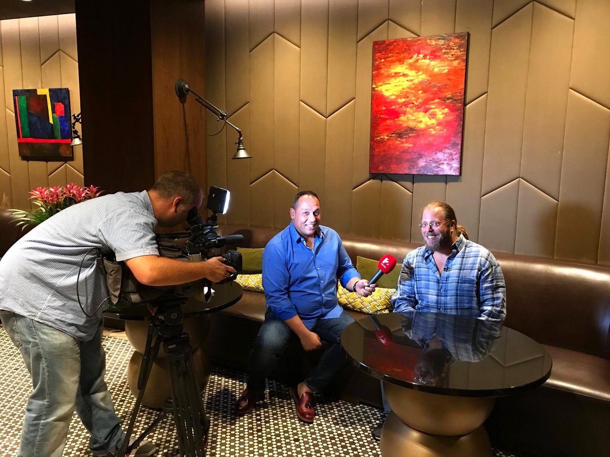 DezerDev's tweet photo. After racing all day in Budapest for #gumball3000, Gil took a pitstop for an interview to talk business. https://t.co/sJavmQX6lN