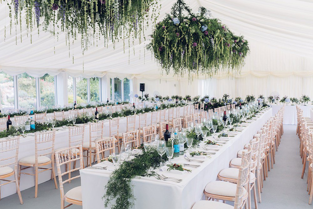 Unbelievably IMMENSE floral arrangements from <a href="/AmieBoneFlowers/">Amie Bone Flowers</a> at this marquee wedding rockmywedding.co.uk/alicia-simon/