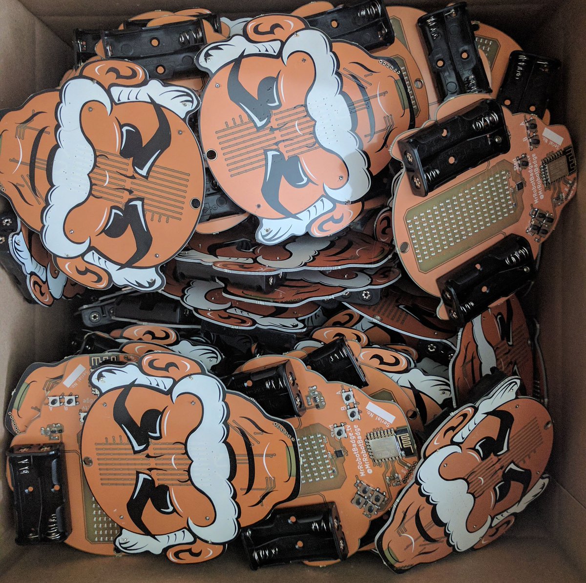 ViolenceWorks's tweet photo. Boxes of badges awaiting programming. #badgelife @defcon https://t.co/kbFAAdixeS