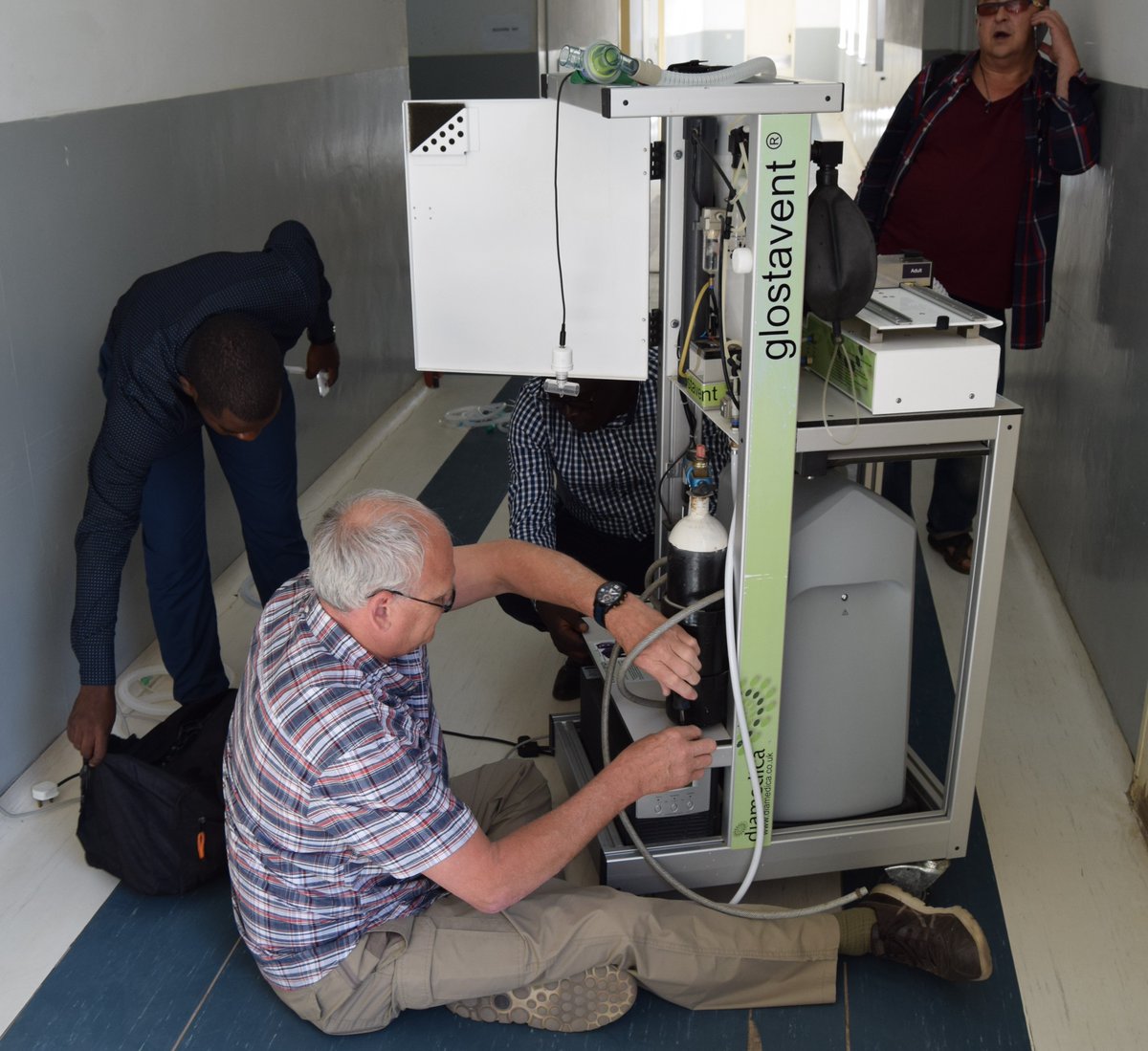 DiamedicaUK's tweet photo. @DiamedicaUK's director lends his maintenance skills - however awkward the position! Work in #Zambia on #Glostavent #anaesthesia machine. https://t.co/R47veCmNtG