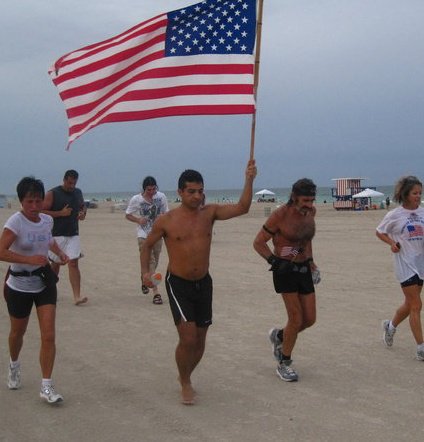llhuttenbach's tweet photo. Major Taco, born in Brooklyn and raised in Mexico, carrying the American flag while #RunningWithRaven 7 years ago. #Happy4th https://t.co/fscF0vrCnr
