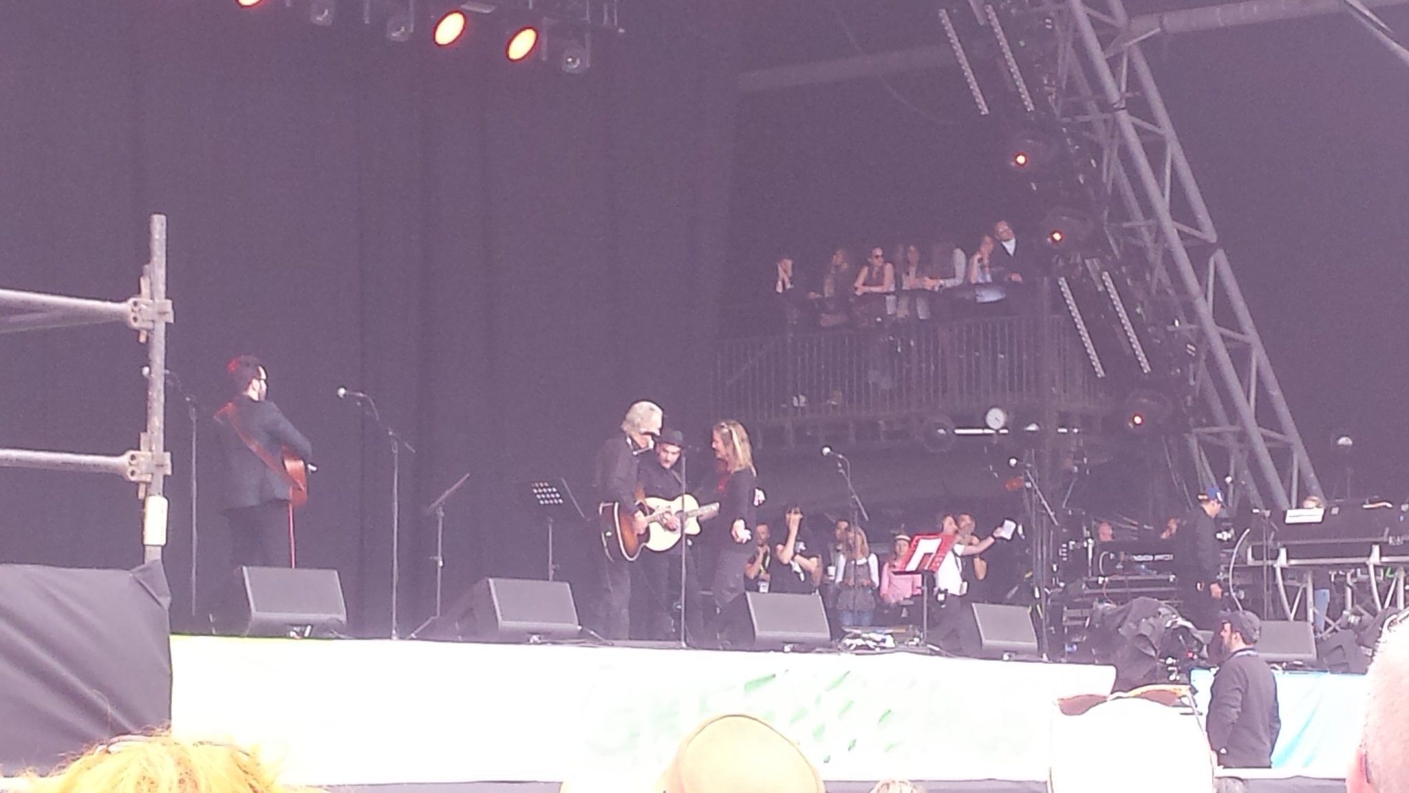 They\re singing happy birthday as Kris Kristofferson tunes up. 