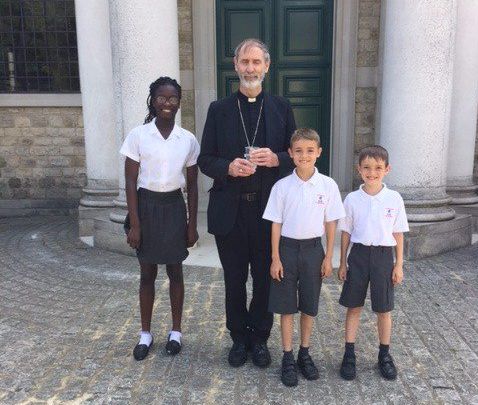 Bishop Alan Williams, Bishop of Brentwood, poses for photo with St Thomas' pupils outside the Cathedral on Thursday 22nd June.