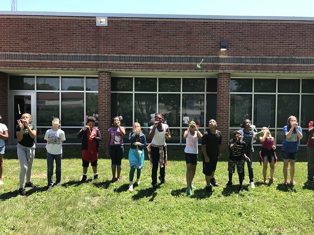 RaytownSchools's tweet photo. 5th graders from Robinson and Norfleet designed and launched paper rockets while learning about force, resistance, and motion. #SmartStart17 https://t.co/Fv1TkSrPdo