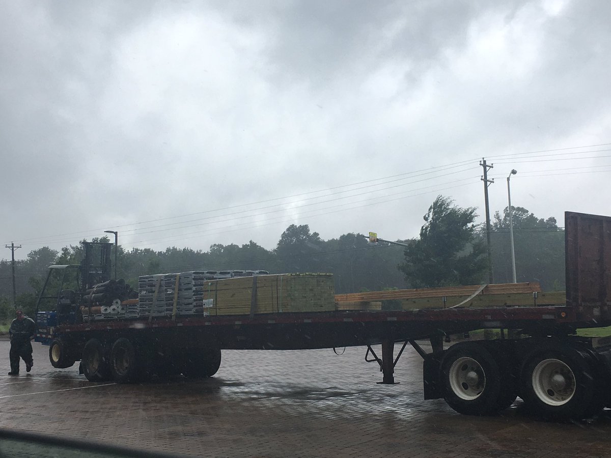 Alison_Norton's tweet photo. What do I do in the summer? Why, go stand at school in the torrential downpour to receive an order of wood #OutdoorLearningLab #OverallCreek https://t.co/kURLCmH52N
