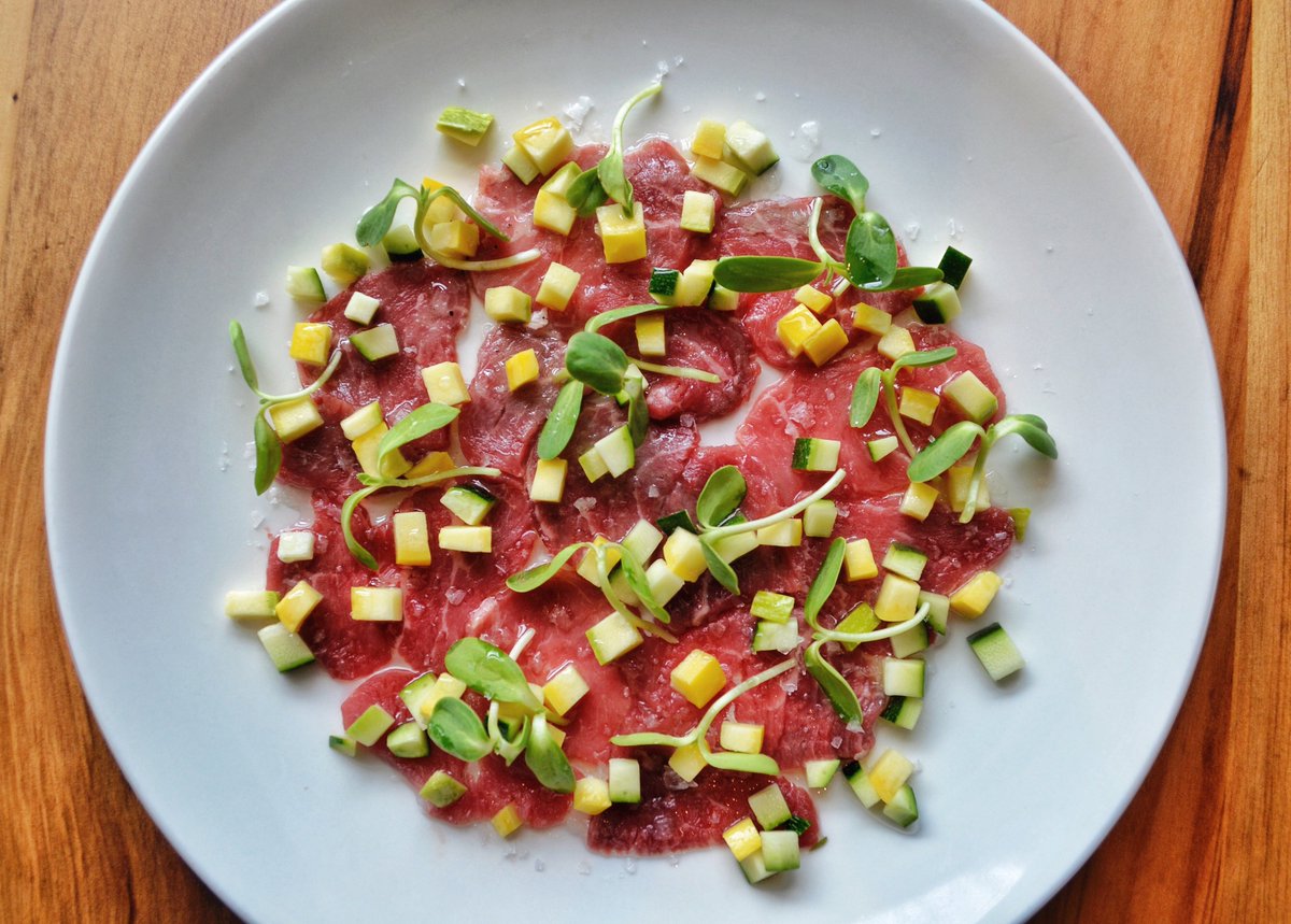 LanternNC's tweet photo. Filet of Grass-Fed Beef Sashimi - #redpollbeef, #elysianfieldsfarm zucchini, yuzu, sansho oil #opendoorfarmnc🌻 https://t.co/5vO1yENBR1