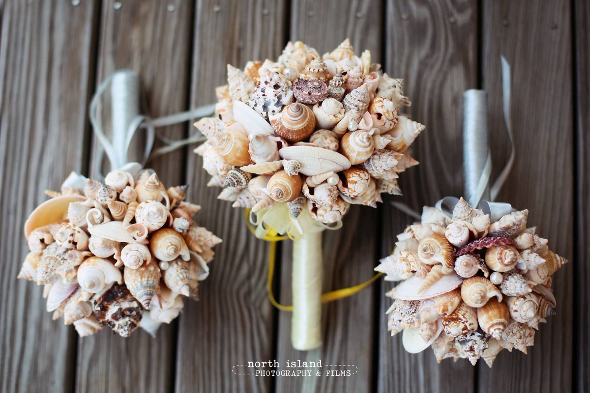 LandsEndCaterer's tweet photo. This couple took their beach themed wedding to the next level with these bouquets! What do you think? Photo: @niphotoandfilms https://t.co/CMzgZudsDE
