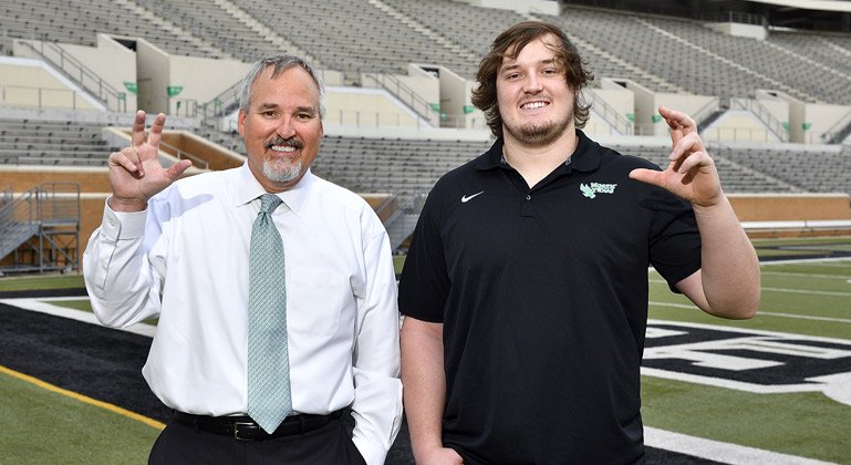 UNTsocial's tweet image. ICYMI, this awesome father-son duo bleed #UNTgreen! Prof Eric Fritsch just welcomed is son Jerod to #UNT: bit.ly/2s0fVUP