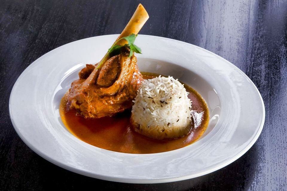 OriginIndiaLV's tweet photo. #Dinner is served! In honor of national flavor week, order our #lambshank which is cooked in a #kashmiri red rogan josh sauce. #nomnom https://t.co/SOhWsny9jT