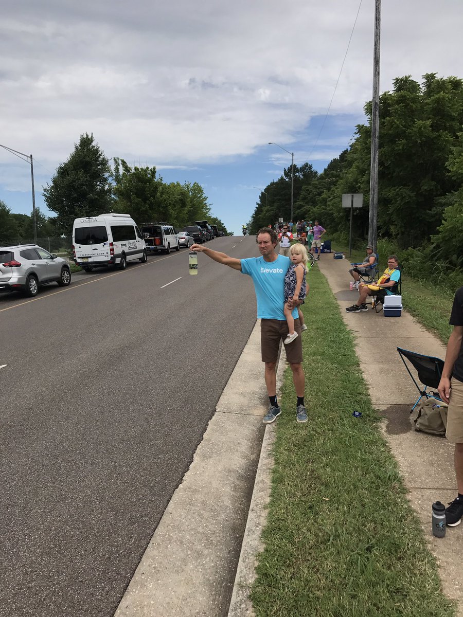 Definition of multitasking. Dad feeding wife, Emily Newsom, who is solo off the front while holding daughter, Marijke. #USPro #feedzone