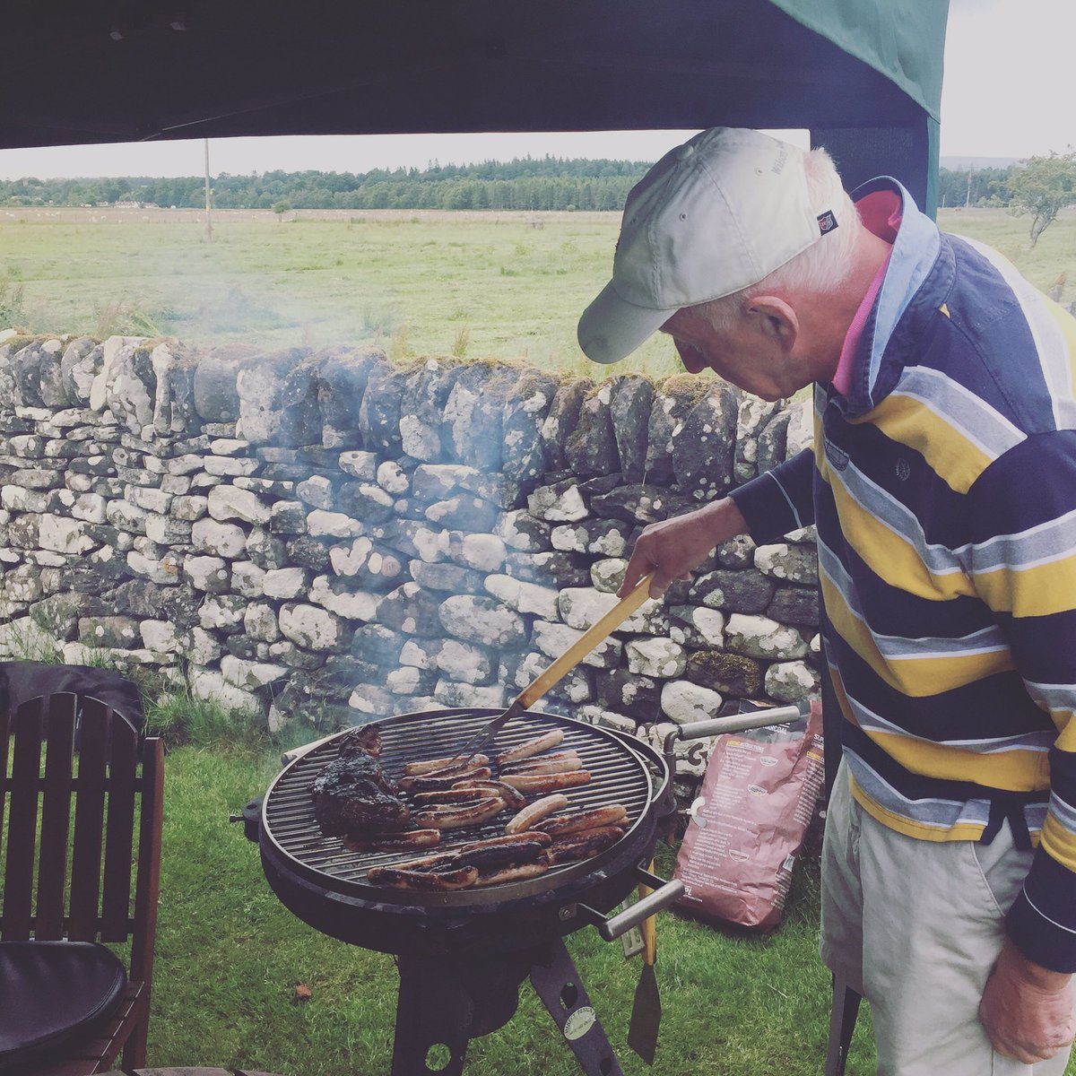 MacDuff1890's tweet photo. The old boy manning the #bbq earlier #macdufflamb #sausages #grilling https://t.co/DYAMCk5w9k