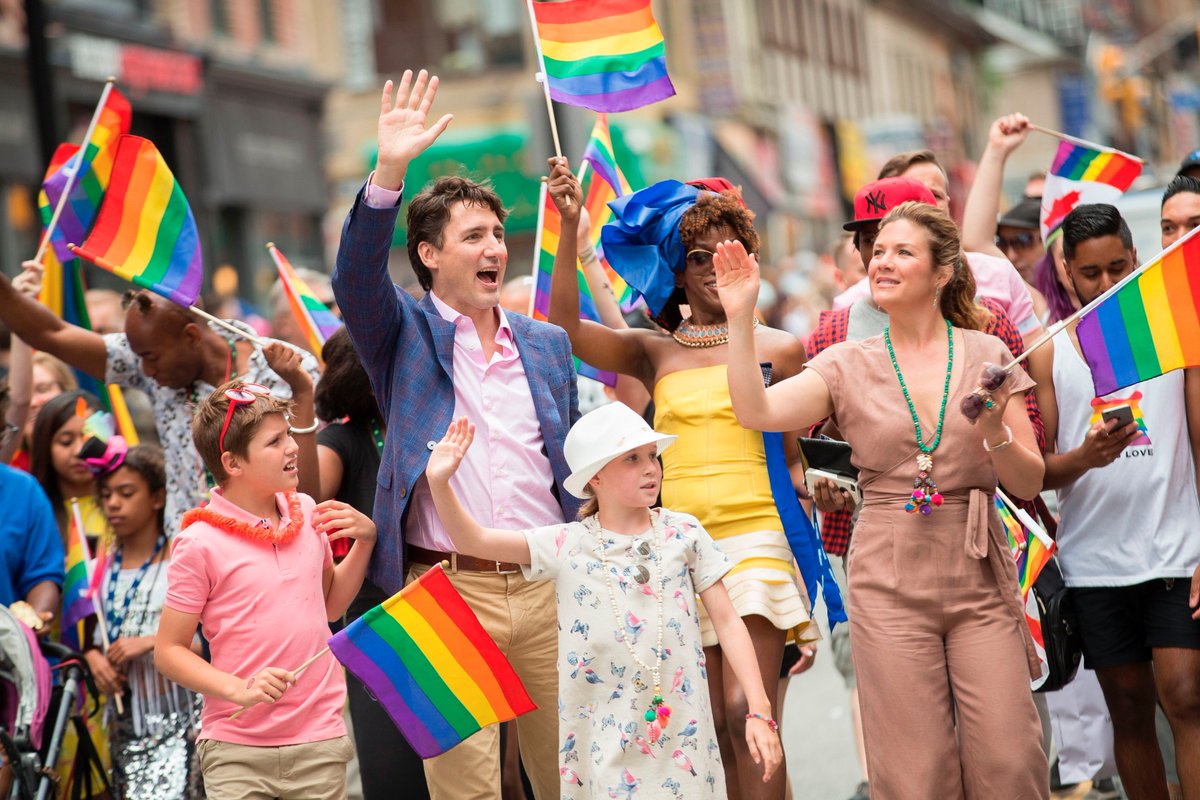 triplejHack's tweet photo. Just Canadian PM @JustinTrudeau leading a #Pride parade in Toronto with his family. Happy Monday ❤️🧡💛💚💙 https://t.co/rXxVK9XfHH