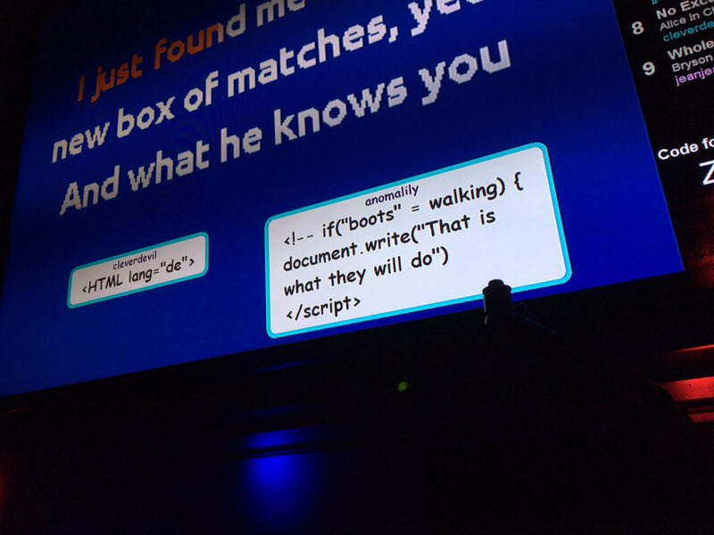 Photo of a karaoke screen with popups from indieweb participants with code inside