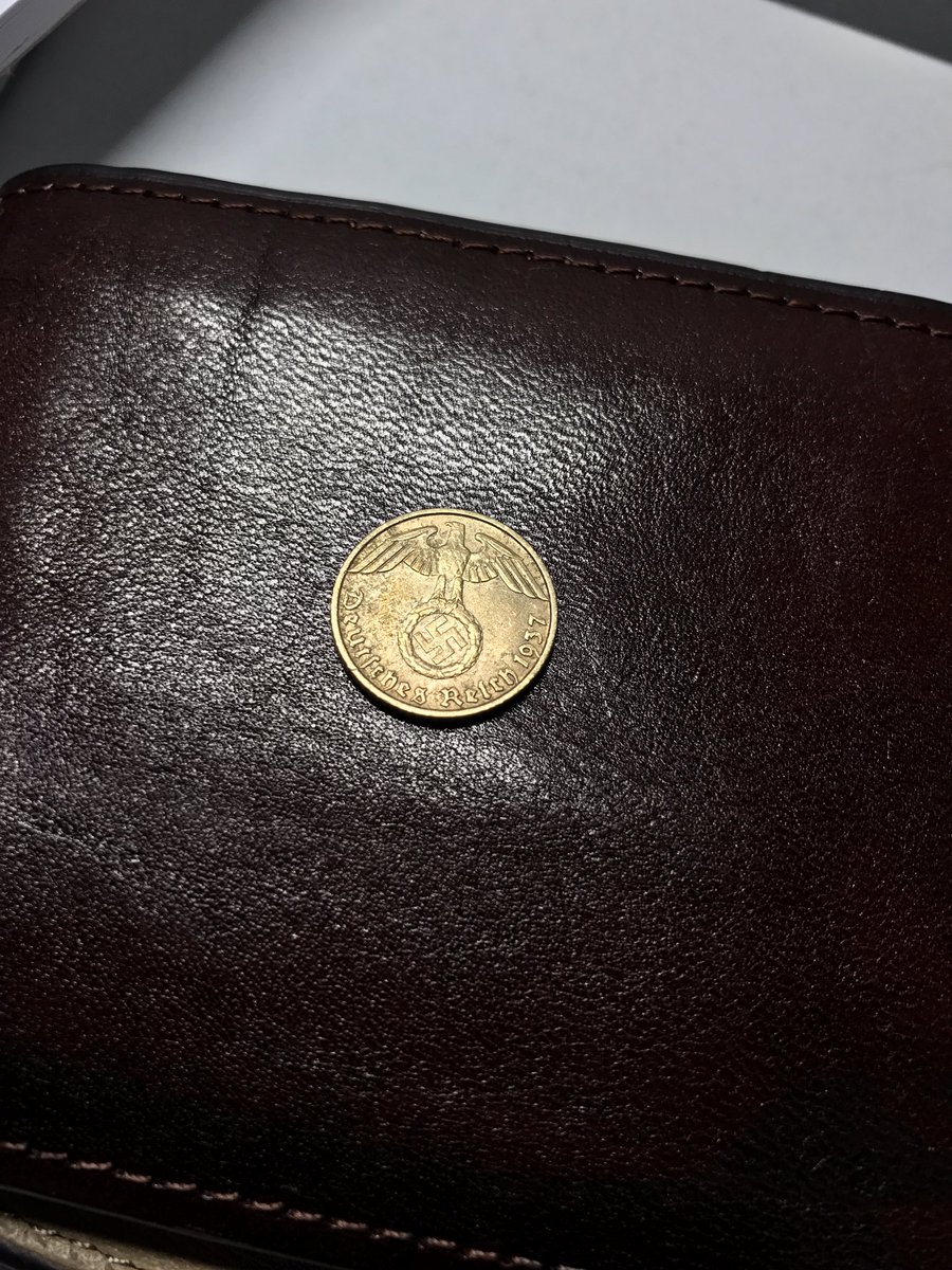 RobHoltby's tweet photo. Got a handful of change from a coffee earlier. What I assumed was just an Isle of Man 5p coin, turned out to be definitely not... #nazimoney https://t.co/vDk6l0hCAQ
