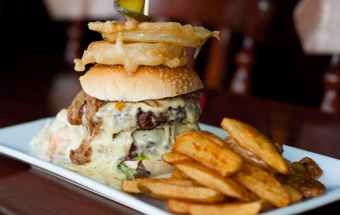 Got the Monday blues? Our John Wayne burger should perk you up. A double burger, cheese, onion rings, pulled pork &amp; bbq sauce. #harrogate