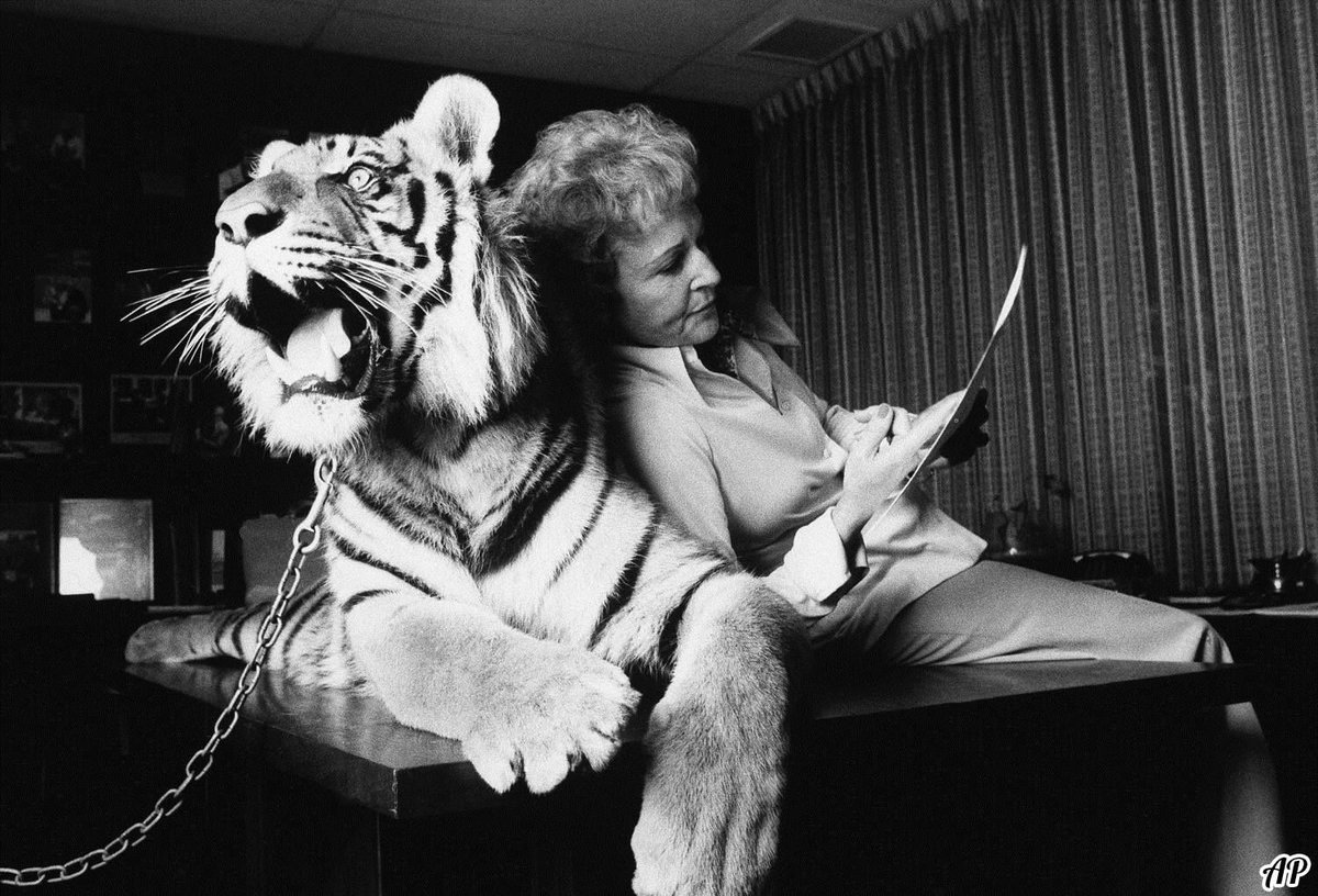 Betty White leans against Sultan, a 300-pound Bengal tiger, 1979. 