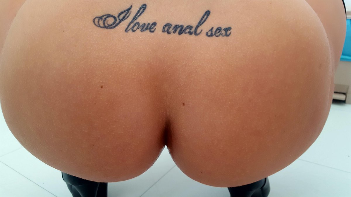 Beauty with "I love anal sex" tattoo. 