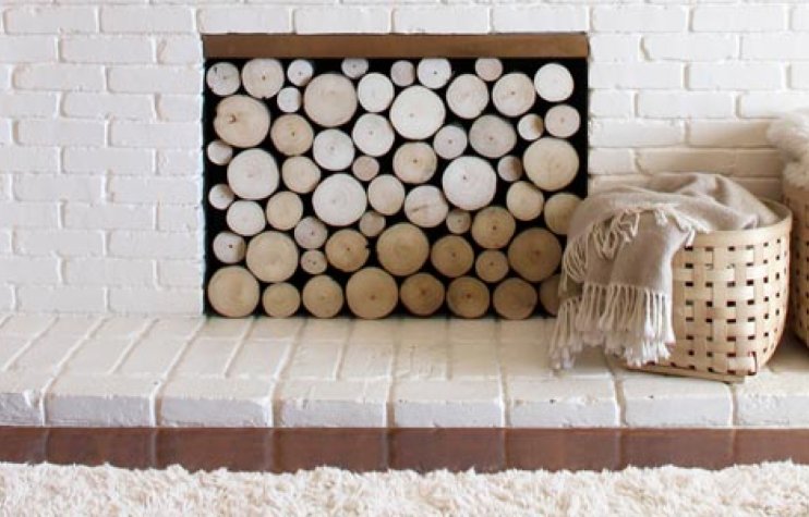 Build a summer front for your fireplace that can be set aside when it's time to light up some firewood.thisoldhouse.com/how-to/how-to-…
