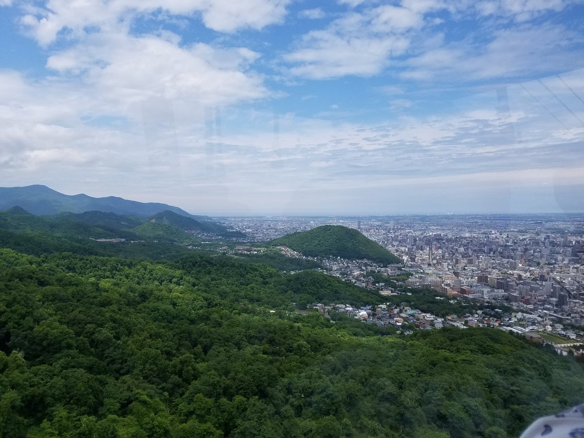 CMDonatelli's tweet photo. Finally got Wifi! No tweets from the morning session but here is a picture of Sapporo + surrounding area from Mt. Moiwa! #AMAM2017 https://t.co/epjofm71HJ