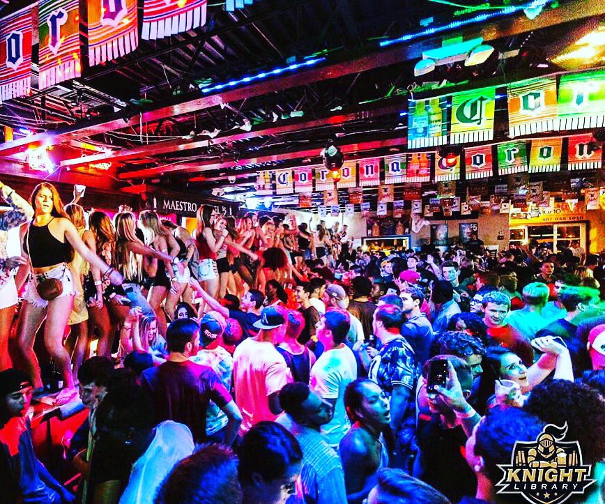 KnightLibrary's tweet photo. Tonight's gonna be INSANE! Doors open at 9pm with lines wrapped around the building at 9:01, brace yourselves #UCF! FREE BUCKETS! 🍻🍸🍹🍾🔊🔊 https://t.co/WYsZTWXoam