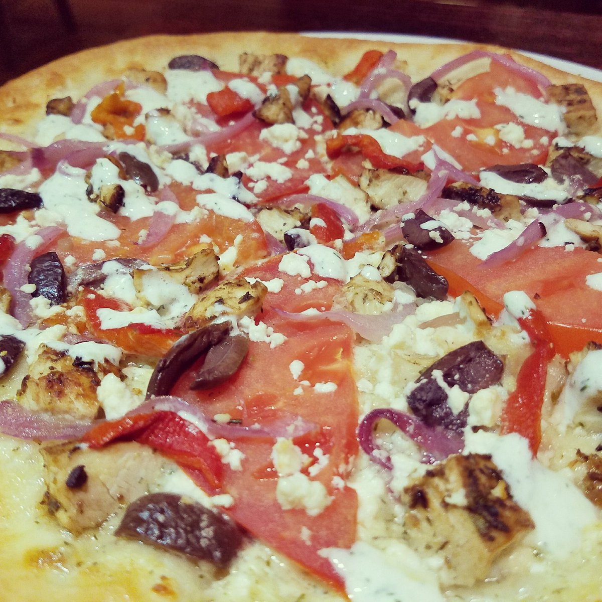 Yum, we have a Mediterranean #Pizza with chicken, red onion, red pepper, olives, feta &amp;  tomatoes from Pfeifer Farm