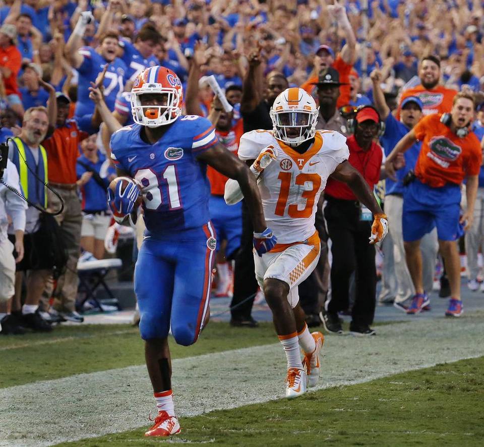 FloridaVault's tweet photo. What’s your fave 4th down Gator play? The top 4 countdown begins July 1 #4thDownFireworks Check out more plays here: https://t.co/7QugEhO4rt https://t.co/ODDTzMaKVe