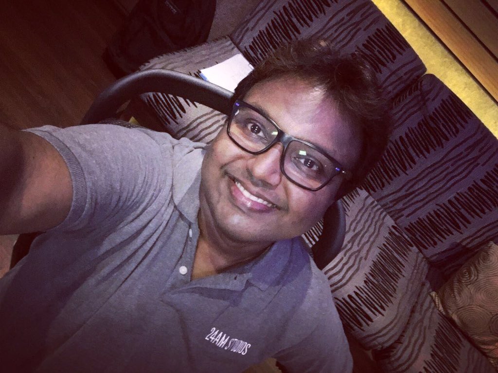 Part of #24AMSTUDIOSfamily our @immancomposer brother wearing #24AMSTUDIOStshirt during composition🎹😊😊🎹
