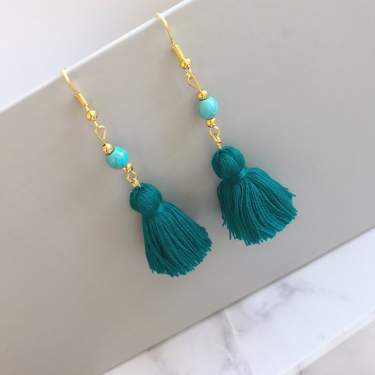 Shop our new teal tassel earrings here....www.thedottylemon.com