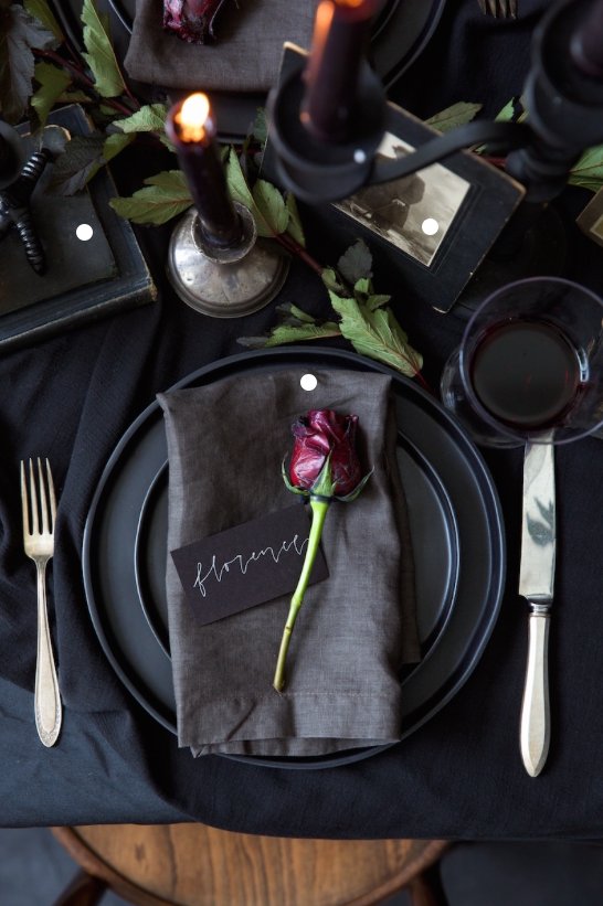 Varying shades of black, mixed materials &amp; deep plum or berry candles create depth to your Halloween-inspired wedding table setting.