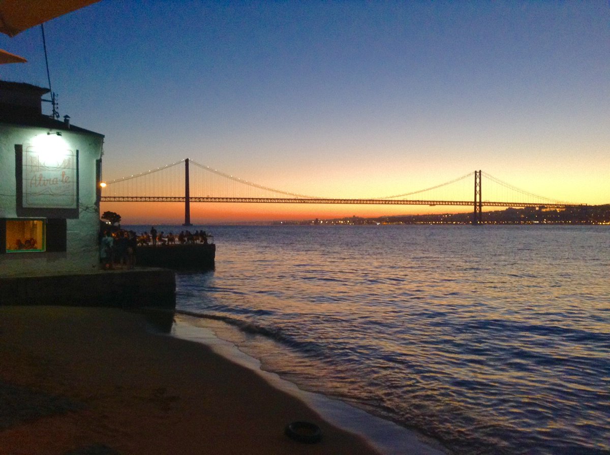thehoteljunkie's tweet photo. #sunste on a warm #summer #night along the #Tagus #river in #Lisbon #Portugal #bridge #Travel #travelblogger https://t.co/4fRtRBaEcv