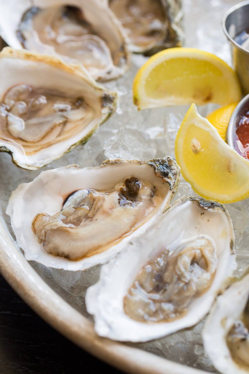 Nothing beats New England summers and $1 oysters. #somerville #patio #latenightmenu #beer #cocktails