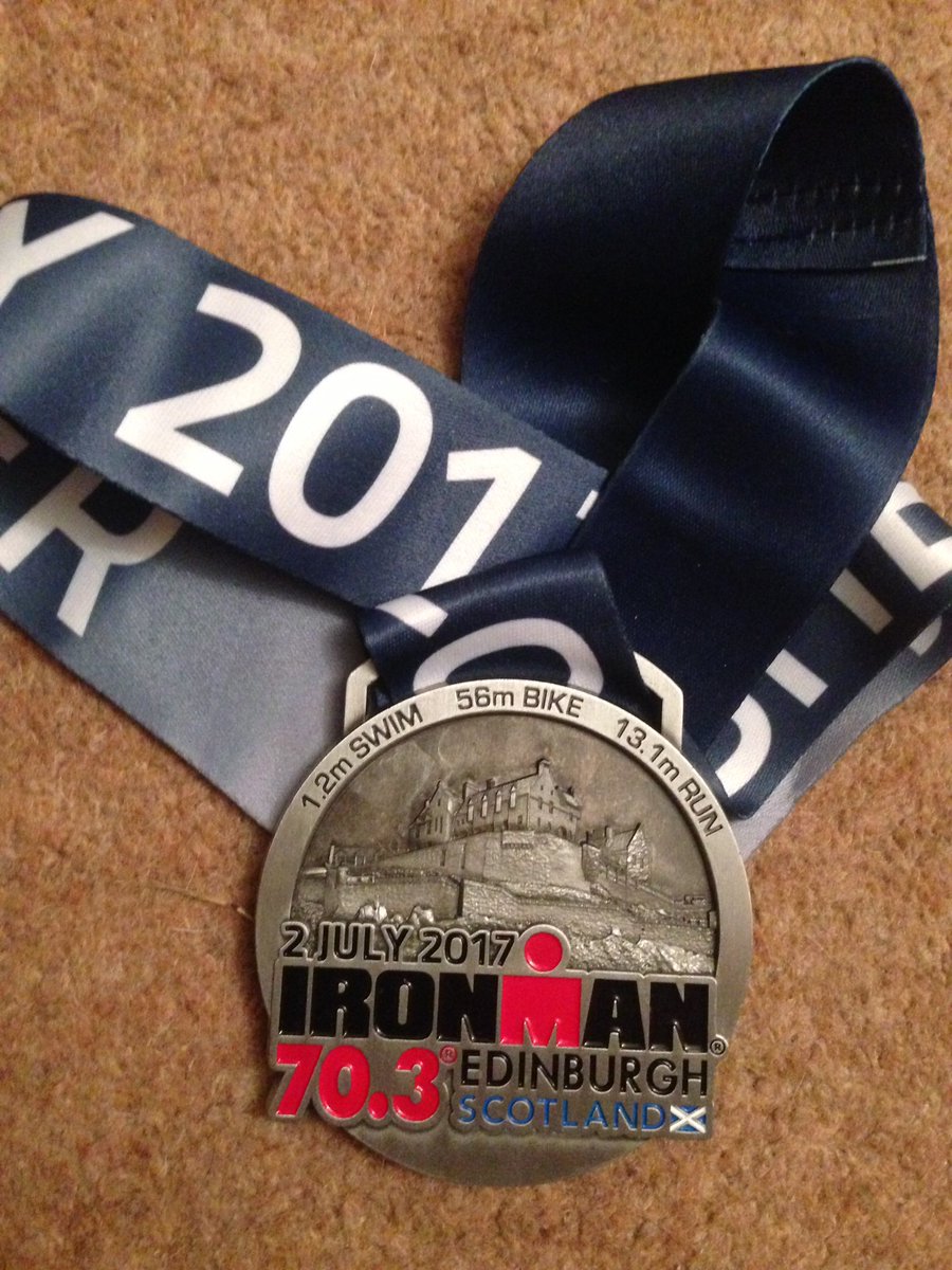 itsmyironman's tweet photo. Hard fought medal 06:05 with shredded toe and a flat tyre.  #edinburgh70.3 https://t.co/oW3UCxEcBy