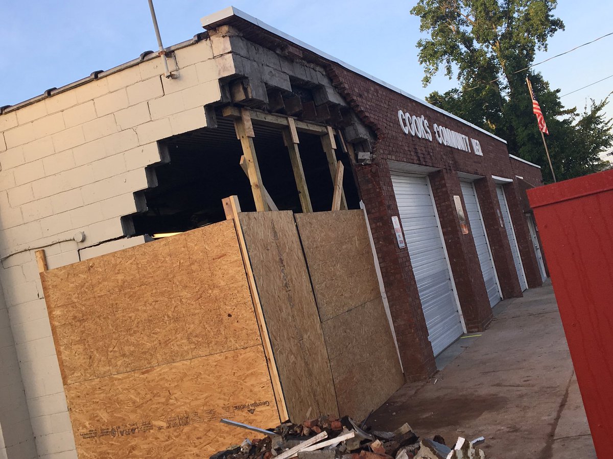 TheDavenReport's tweet photo. NEW: @cookvfd boards up bay destroyed by car. Driver told @CMPD he overcorrected &amp; slammed into building after letting another car pass #CLT https://t.co/EjpNXcwX4t