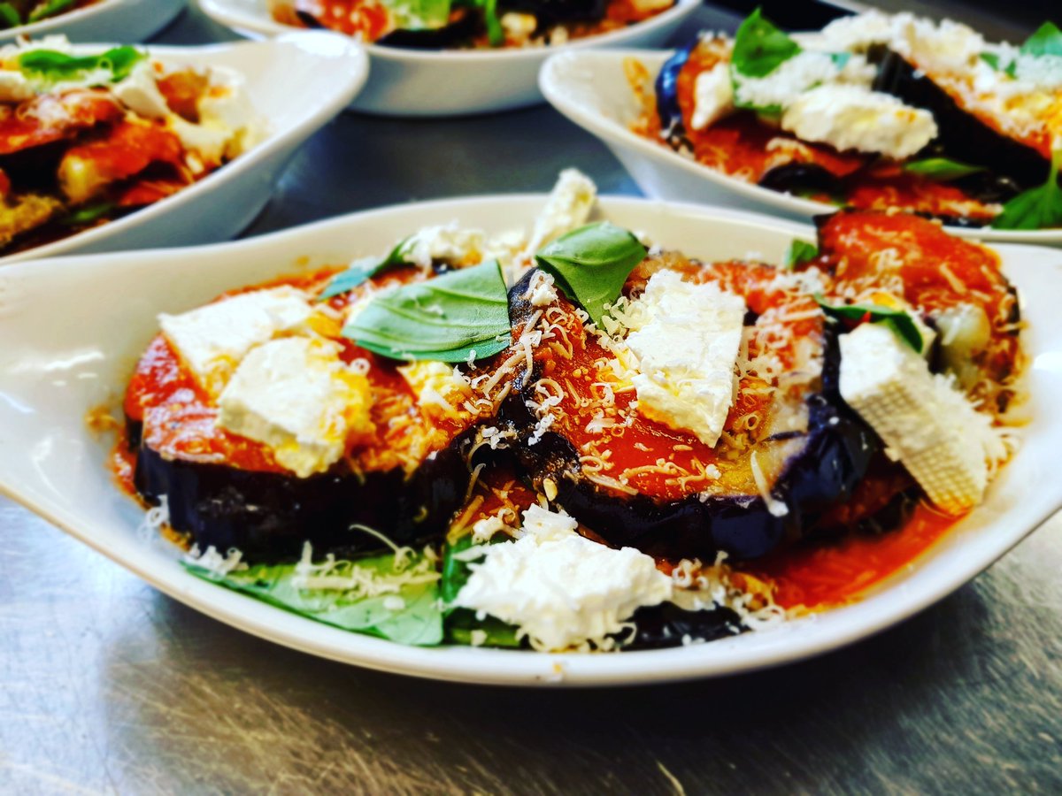 Aubergine and feta cheese bake topped with parmesan and fresh basil 🌿🌞