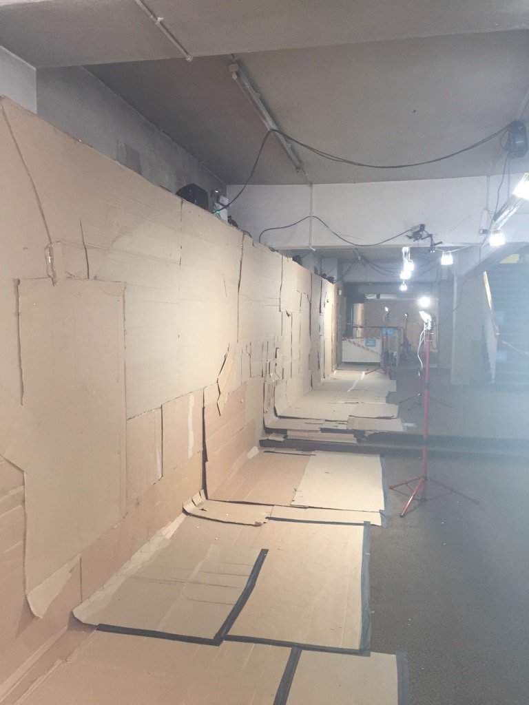 JohnFactoryInt's tweet photo. A wall of cardboard awaits @underworldlive and @theboyhyde as #mcrstreetpoem gets underway  https://t.co/jKF9D5uDs8 https://t.co/mDBPLcLUk4