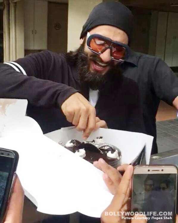 Ranveer Singh looks really happy to cut his birthday cake with his fans view HQ pics  