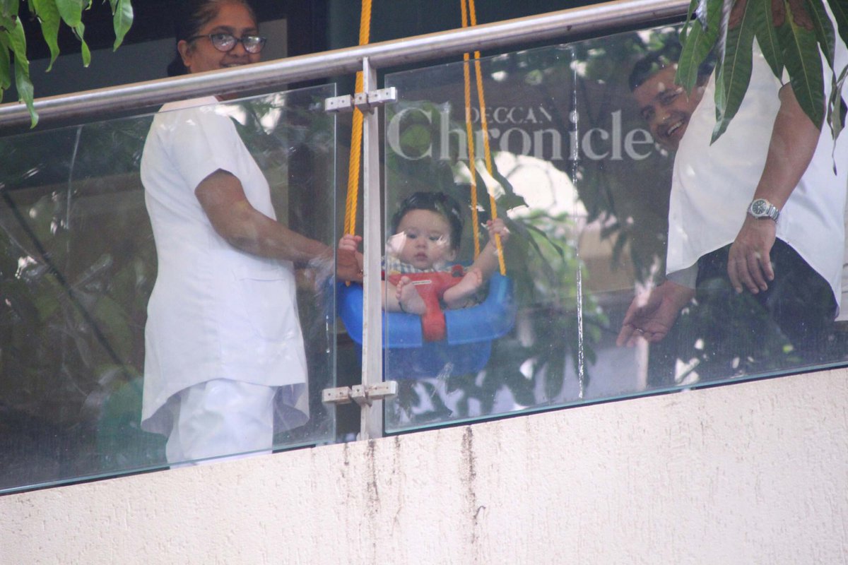 EntDC's tweet photo. Cute! Prince #TaimurAliKhan adorably takes in the view from his mini swing set in these pics.
https://t.co/sOXFQ0BnSg https://t.co/vWdEeJsttv