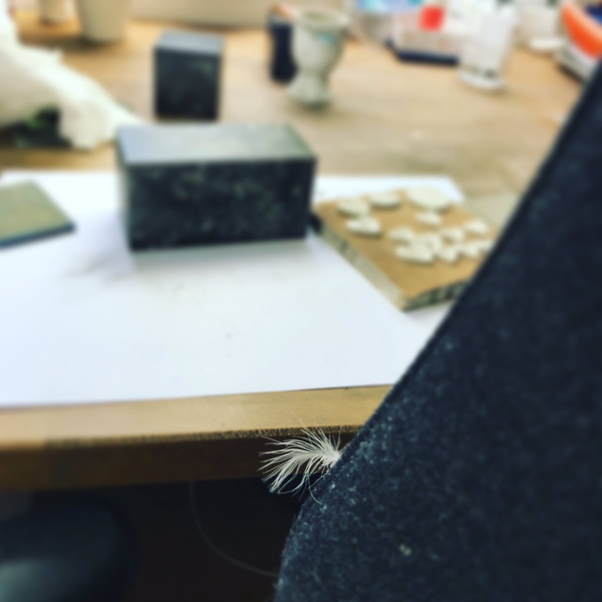 ForeverInSilver's tweet image. My desk full of #memorial orders and this #littlewhitefeather appears by my right arm. #asign