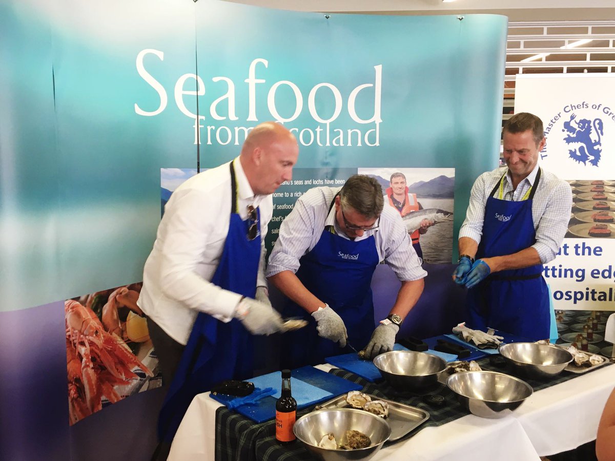 SeafoodFromScot's tweet photo. The final oyster shucking of the day with key foodservice players- @IanNottage &amp; John Fenney from @griffithfoods &amp; @LeeMaycock1 @Craft_Guild https://t.co/4GquMIUrIa