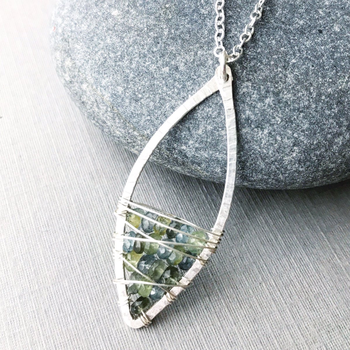 lenajamesdesign's tweet photo. The Moss Aquamarine Scatter Marquise shimmers with the deepest colors from the #forest to the #sea. 💙💚✨ #aquamarine #silver #marquise https://t.co/maiI8ZXc4N