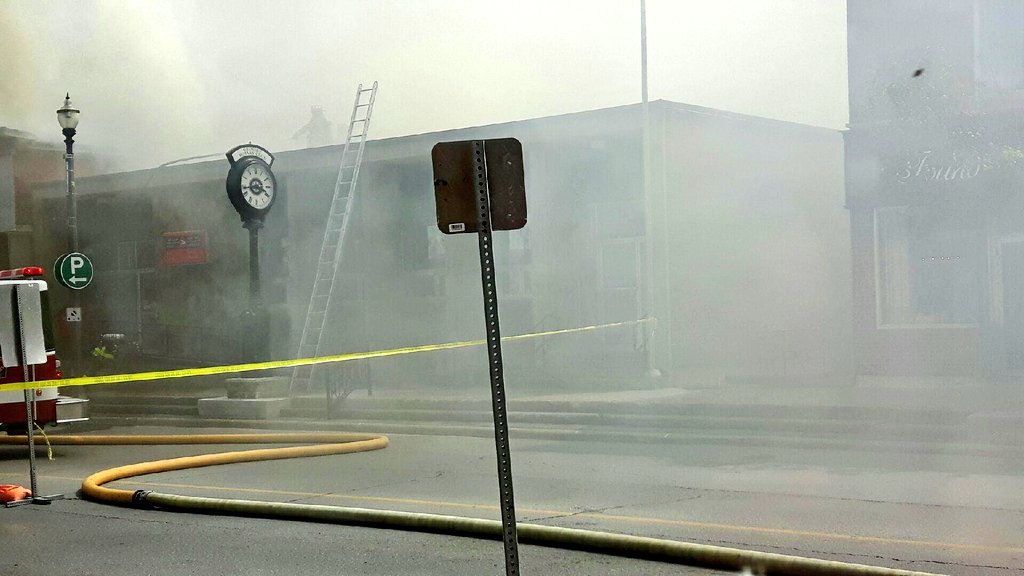 Photos sent to me from ongoing fire on Main Street in #Grimsby. <a href="/TOLFireRescue/">Lincoln Fire Rescue</a> and @WestLincolnFD assisting. 1/4 mile radius evacuated.