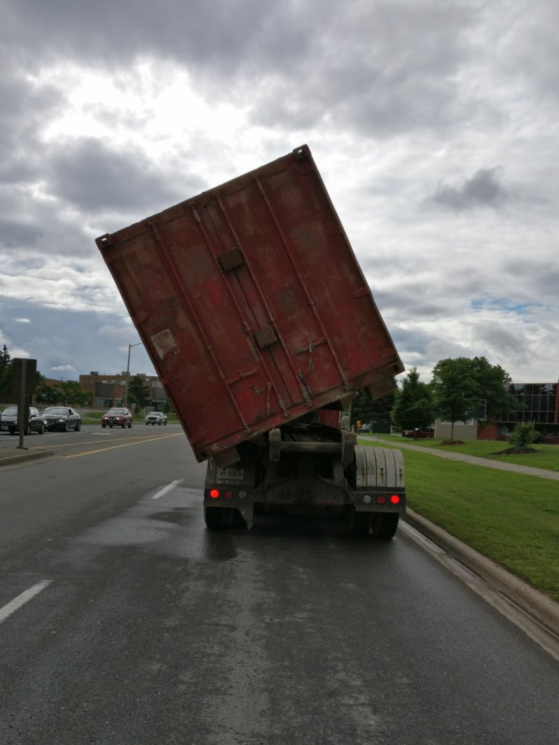 YRP's tweet photo. TIP OF THE DAY (literally) - Found cruising in Vaughan, this truck is a pretty good example of how NOT to secure a cargo container. #yikes https://t.co/tRPyD5Uj2q