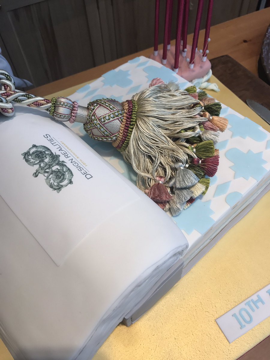 DesignRealities's tweet image. Me with our fabric book cake that's too good to present to a design meeting!