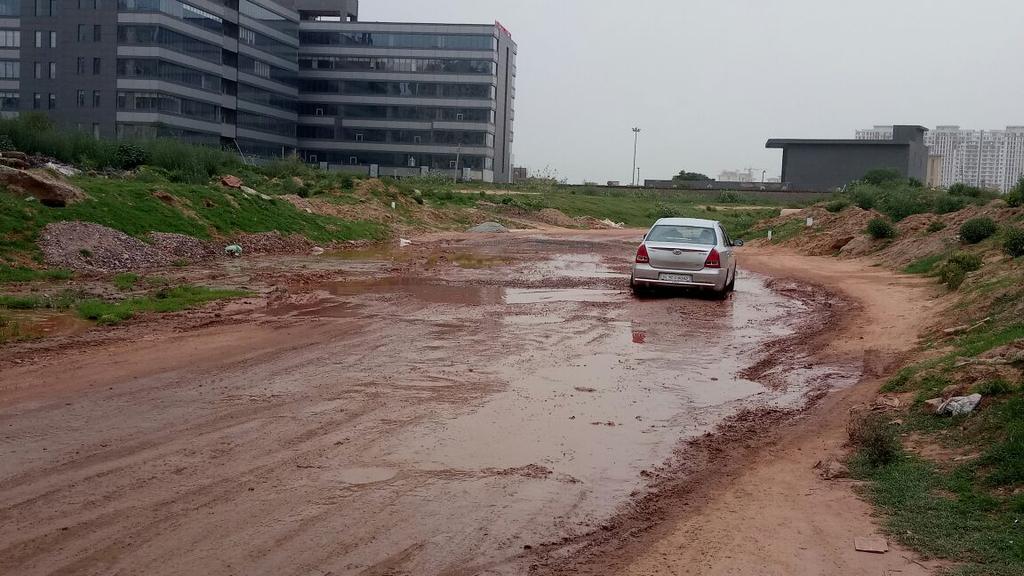 TOIGurgaon's tweet photo. #InfraWoes All potholes, no road. This is in Sector 62, along the Southern Peripheral Road, reports @bagishjhaTOI https://t.co/BGtPFuL9qf