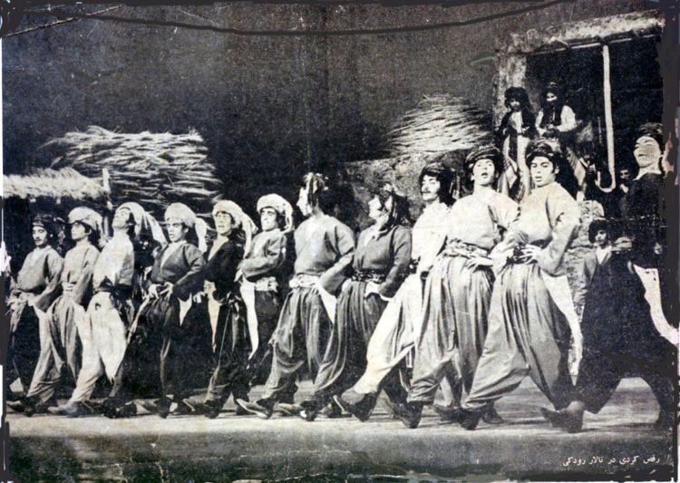 Old photo of Kurdish men dancing.
