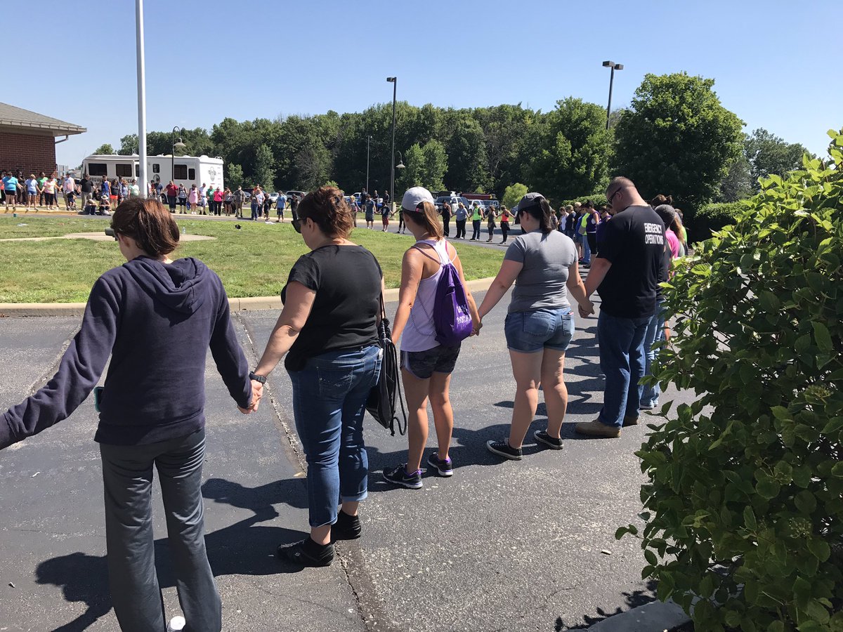 Volunteers praying together at #brownsburg middle school