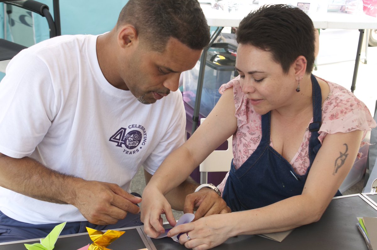 expressionesnl's tweet photo. New London City Councilor Efrain Dominguez and State Representative Chris Soto stopped by for some origami!! #Sailfest2017 #expressiones https://t.co/wPat9HDeqC